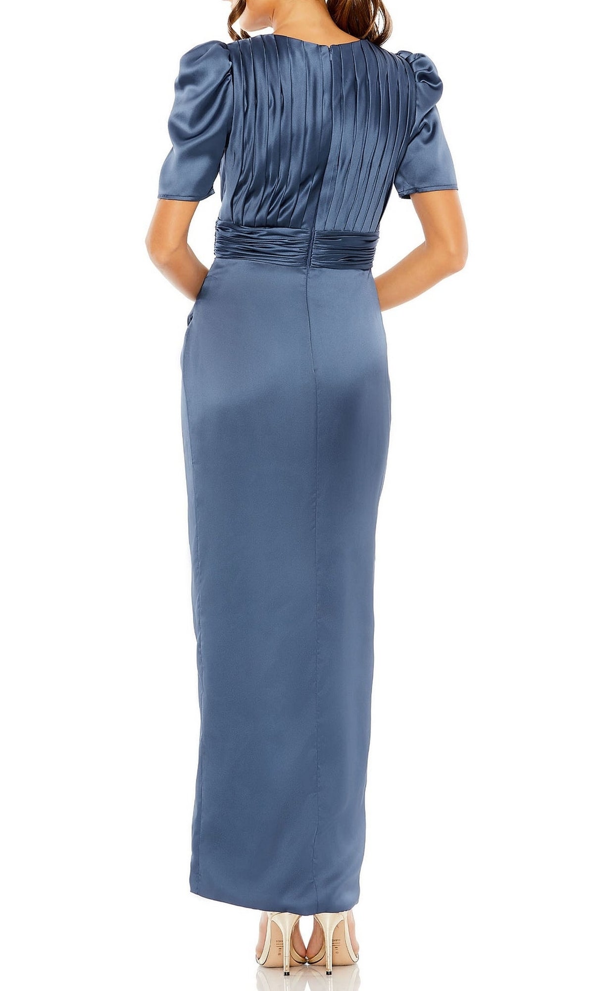 A woman is photographed from behind wearing the Mac Duggal 27014, a short-sleeve, floor-length blue formal dress with satin fabric and pleated upper back details.